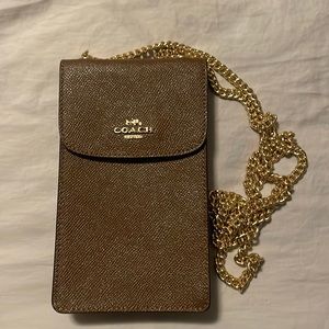 Coach crossbody phone case. Never used in brown leather and gold chain